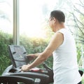 Close up Asian senior man exercising on treadmill Royalty Free Stock Photo