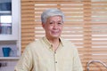 Close up of asian senior man smiling and looking at camera, Happy old asia male stay at home, Active ederly, retirement lady Royalty Free Stock Photo