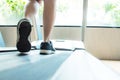 Close-up of Asian shoes running on a treadmill and exercising at the gym Health care concept