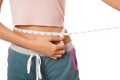 Close up Asian slim girl measuring her waist with tape Royalty Free Stock Photo