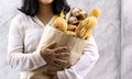 Close up Asian housewife woman hold grocery bread bag
