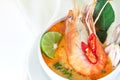 Close up Asian Spicy soup with shrimp in white bowl , famous Thai food cuisine calling Tom Yum Kung Royalty Free Stock Photo