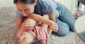 Close-up Asian toddler little girl daughter with mother and playing on carpet on the floor having fun and joyful in living room at