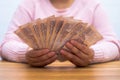 Close up of asian woman with calculator counting money.Woman calculate the spending at home Royalty Free Stock Photo