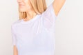 Close-up asian woman with hyperhidrosis sweating. Young asia woman with sweat stain on her clothes against grey Royalty Free Stock Photo