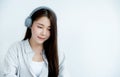 Close up of Asian woman portrait with headphones looking straight ahead Royalty Free Stock Photo