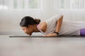 Close up.Asian woman practising yoga, Cobra exercise, Bhujangasana stance, working out, and wearing sportswear