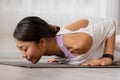 Close up.Asian woman practising yoga, Cobra exercise, Bhujangasana stance, working out, and wearing sportswear