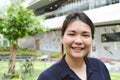 Close up of Asian woman smiling.