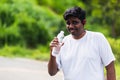 Sport runner black man wear athlete headphones he drinking water from a bottle Royalty Free Stock Photo