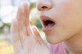 Close up,Asian young woman raised her hand near her mouth to whisper or speaks softly and gossip,child girl telling a secret or Royalty Free Stock Photo