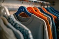 Close-up of assorted colorful clothes hanging on a rack, focusing on fashion and wardrobe organization Royalty Free Stock Photo