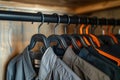 Close-up of assorted colorful clothes hanging on a rack, focusing on fashion and wardrobe organization Royalty Free Stock Photo