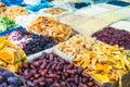 Close up assorted dried fruits and berries on market place in Tel Aviv, Israel. Selective focus, space for text. Royalty Free Stock Photo
