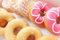 Close up of assorted glazed sweet donuts in a paper box . Royalty Free Stock Photo