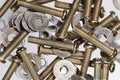 Assorted metal nuts and bolts isolated on a white background