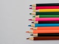 Close up of an assortment of colored pencils. Background of colo