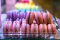 Close-up of assortment of french macarons on a tray for sale, indoors