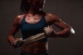 Close up of athletic healthy lean tone top body of asian woman holding white strap with both hands preparing for training or