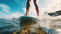 Close up athletic legs of young woman who active rides wave on surf style wakeboard, Many water droplets around