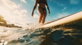 Close up athletic legs of young woman who active rides wave on surf style wakeboard, Many water droplets around