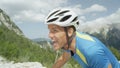 CLOSE UP: Athletic man going through grueling exhaustion during cycling tour.