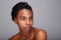 Close up attractive black woman with bare shoulders and clean skin Royalty Free Stock Photo