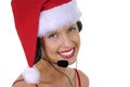 Close up of attractive female call center telephonist with telephone headset and Christmas Santa hat
