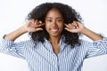 Close-up attractive happy smiling nice african american girl afro haircut put fingers ear holes unhear unwilling listen