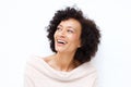 Close up attractive middle age african american woman laughing against white background Royalty Free Stock Photo