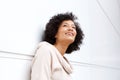 Close up attractive middle age african american woman smiling in contemplation Royalty Free Stock Photo