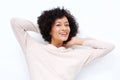 Close up attractive middle age african american woman smiling with hands behind head against white background Royalty Free Stock Photo