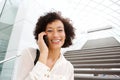 Close up attractive middle age african american woman smiling and talking with smart phone Royalty Free Stock Photo