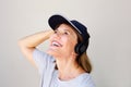 Close up attractive middle age woman smiling with headphones Royalty Free Stock Photo