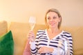 Close up of an attractive woman in her 40s holding a glass of champagne Royalty Free Stock Photo