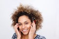 Close up attractive young african american woman listening to music against white background Royalty Free Stock Photo