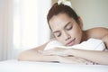 Close up of attractive young Asian woman sleeping during getting Spa treatment Royalty Free Stock Photo