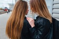 Close up of attractive young couple whispering to ear a secret and smiling. Happy relationship concept Royalty Free Stock Photo