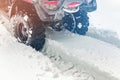 Close-up ATV 4wd quad bike in forest at winter. 4wd all-terreain vehicle stand in heavy snow with deep wheel track. Seasonal Royalty Free Stock Photo