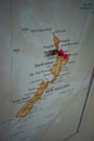 Close up of Auckland pin pointed on the world map with a pink pushpin Royalty Free Stock Photo