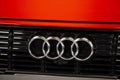 Close up of the Audi car brand logo on black and red background