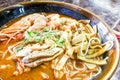 Close-up of authentic delicious Sarawak Laksa with big prawns