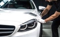 Close up of a auto body mechanic buffing a scratch on car