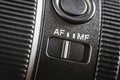 Closeup of the auto or mannual focus button on the new camera lens. Af and mf switch on the camera lens, controls of a mirrorless Royalty Free Stock Photo