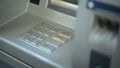 Close-up of automated teller machine, buttons on ATM, secure money withdrawing