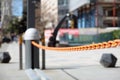 Close-up of an automatic barrier with an orange chain at the entrance to an underground parking in the city