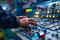 Closeup of an automation engineer calibrating a robotic assembly line control panel in focus