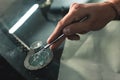 Close up Automobile glazier worker fixing and repair windscreen or windshield of a car in auto service station garage Royalty Free Stock Photo