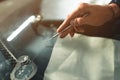 Close up Automobile glazier worker fixing and repair windscreen or windshield of a car in auto service station garage Royalty Free Stock Photo