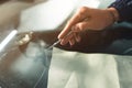 Close up Automobile glazier worker fixing and repair windscreen or windshield of a car in auto service station garage Royalty Free Stock Photo